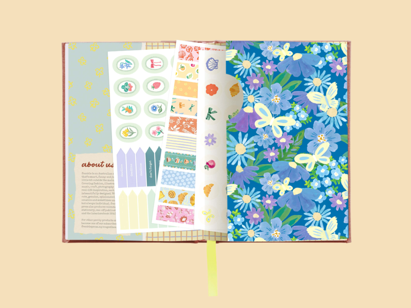 Inside the diary featuring pages of colourful stickers and a storage pocket.