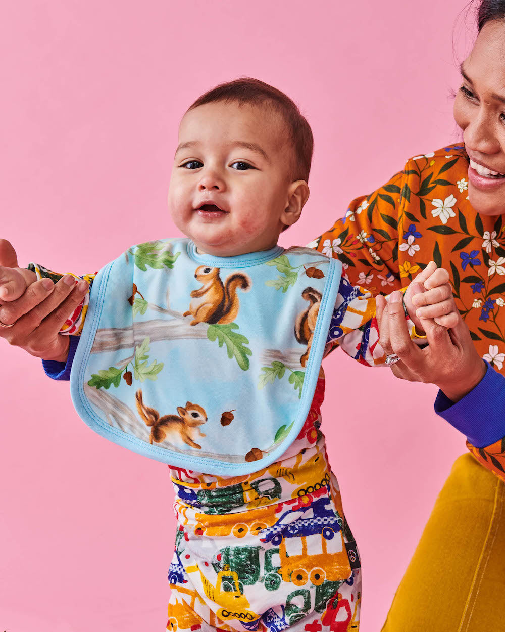 Kip & Co Squirrel Scurry Bib modelled by a baby