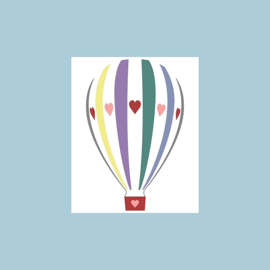 A greeting card with a minimalist illustration of a hot air balloon with colorful vertical stripes in purple, green, yellow, and blue, accented with pink and red hearts, against a solid light blue background.