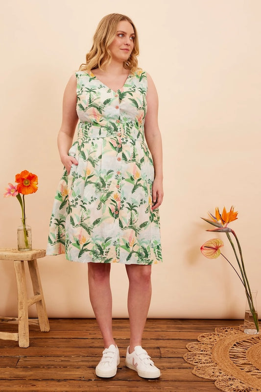 Model is wearing Emily & Fin Scarlett Victorian Glasshouse Dress paired with white sneakers.