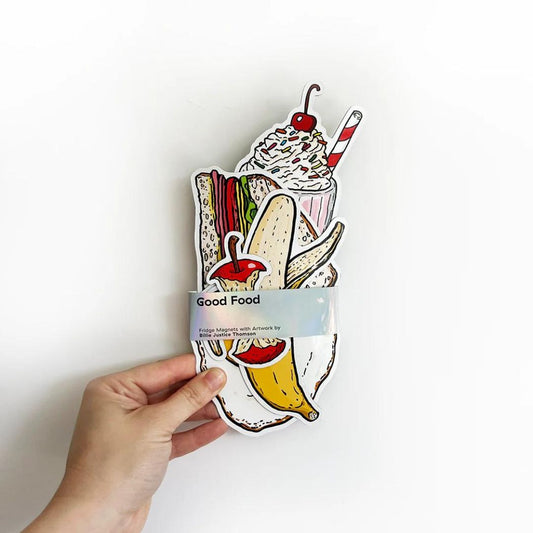 Billie Justice Thomson Good Food Magnet Set with the label around the group of magnets. Magnets are being held in a model's hand