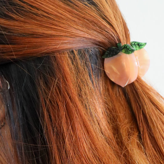 Jenny Lemons Mini Peach Hair Claw
clipped onto model's hair