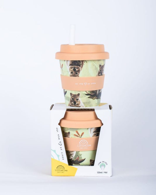 Two Little Cino Social Quokka Babycino Cups stacked on top of one another. The top one has a white coloured straw inserted through the mouthpiece. The bottom on is in its paper packaging box.