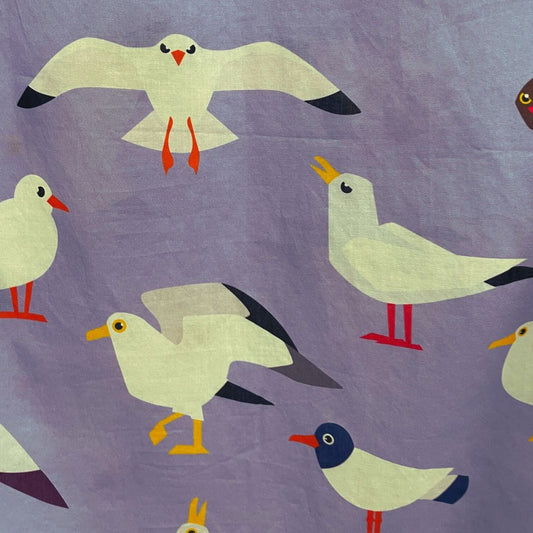 Close up of the top featuring seagulls in various postures.