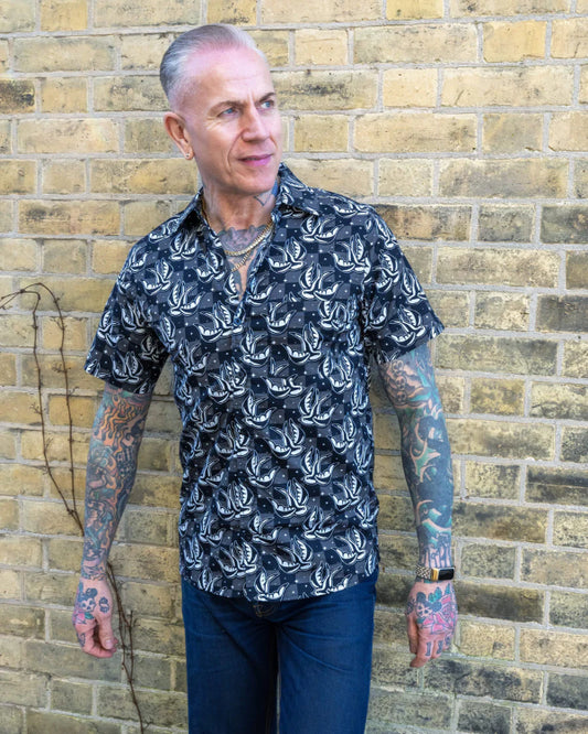 Model is wearing Run and Fly Swallows Checkerboard Shirt