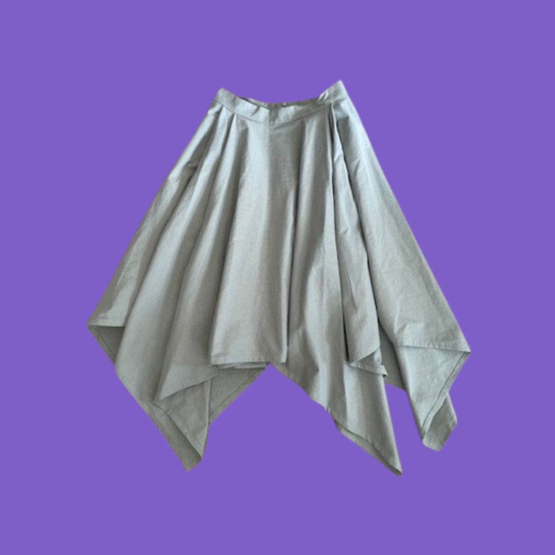 Pale sage green skirt on a purple background