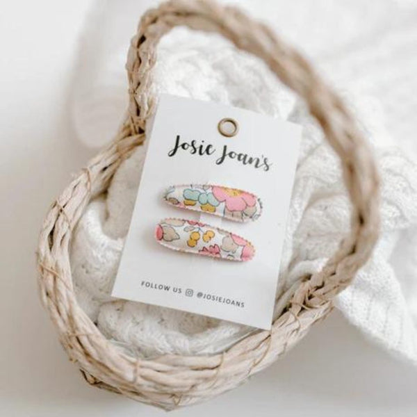 Josie Joan's Mini Hair Clips in Poppy in a woven basket