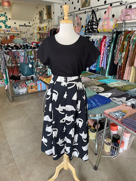 Front view of Mabel our Mannequin wearing Origami Doll Ashley Cat Skirt with a black top