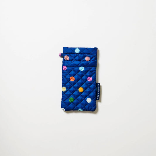 Blue quilted glasses pouch with colorful polka dots on a white background