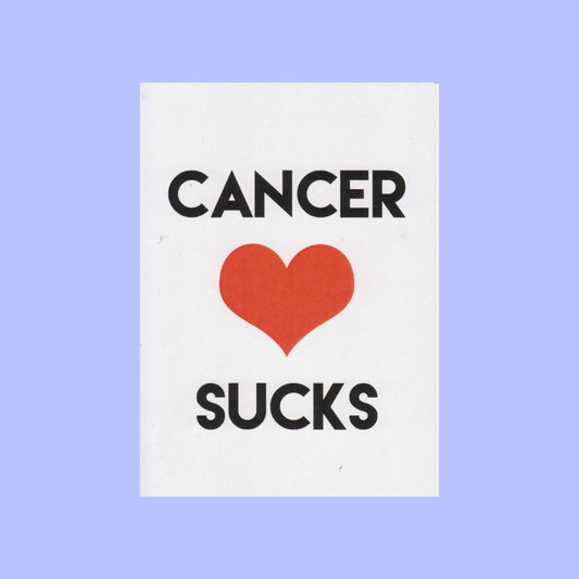 A white rectangular card with the text 'CANCER' above a red heart and 'SUCKS' below, centered on a light periwinkle background.