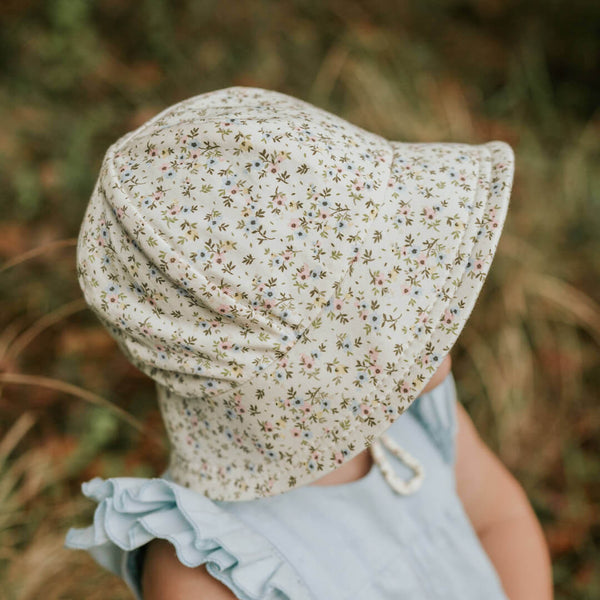 Side view of Bedhead Charlotte Bucket Hat for 1-2 years worn by a young model