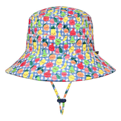 A children's bucket hat with a blue and white gingham pattern and a colourful print of smiling cartoon fruits, including pineapples, strawberries and oranges. It features an adjustable chin strap with a dark blue toggle.