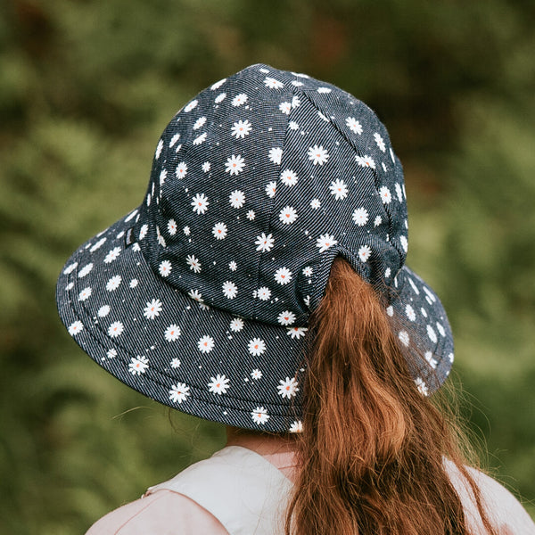 Back view of Bedhead Dani Bucket Hat worn by young model with ponytail pulled through the back of the hat.