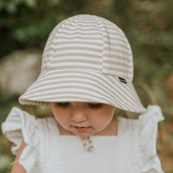 Front view of Bedhead Natural Stripe Bucket Hat for 1-2 years worn by a young model