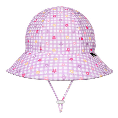 A light purple and white gingham swim bucket hat with a small multicolour floral print, featuring a chin strap and a small black Bedhead tag on the side.