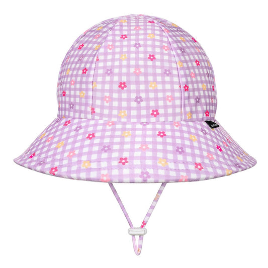 A light purple and white gingham swim bucket hat with a small multicolour floral print, featuring a chin strap and a small black Bedhead tag on the side.