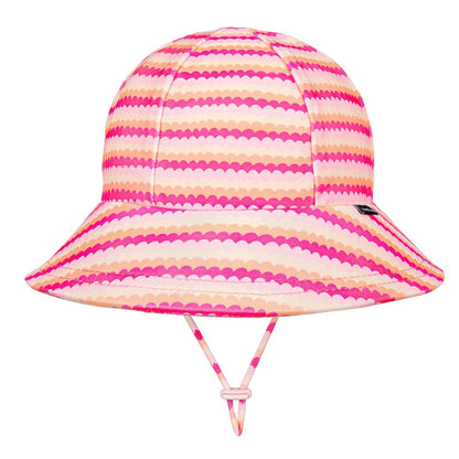 A swim bucket hat with a vibrant pink, orange and white scalloped horizontal stripe pattern, featuring a matching chin strap on a solid white background.