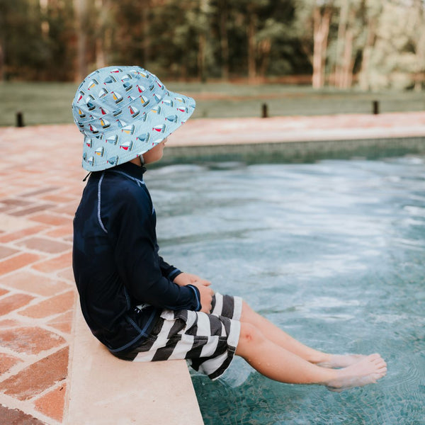 Side profile of Bedhead Sails Swim Bucket Hat worn by a young model