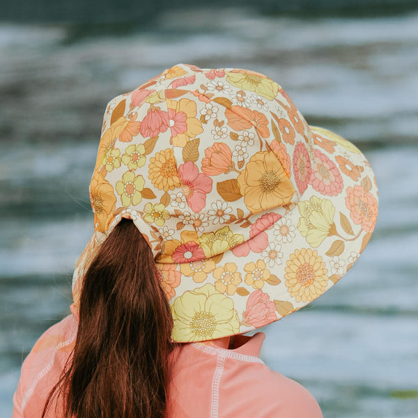 back view of Bedhead Tallulah Swim Bucket Hat worn by a young model with ponytail through the back of the hat