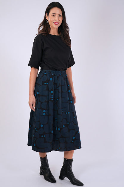 Model wears Essaye Isabel Bauhaus Skirt in Black/Blue.