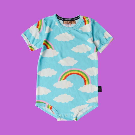 Kip & Co Cloudy Dayz Short Sleeve Romper - Baby onesie with rainbow and cloud pattern on a purple background