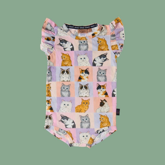 Kip & Co Kitty Cat Short Sleeve Frill Romper - a baby romper with cat pattern on a green background