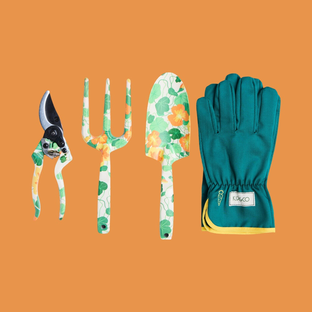 Gardening tools with nasturtium print and green coloured gardening gloves on an orange background