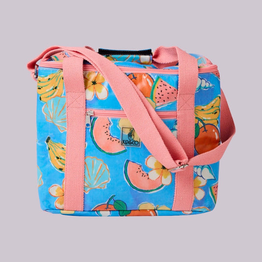 Kip & Co Paradise Found Cooler Bag. Colourful tropical fruit patterns on the bag with peachy-orange straps and trimming.