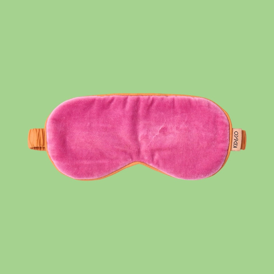 Kip & Co Pink Velvet Eye Mask - Pink eye mask with orange accents on a green background