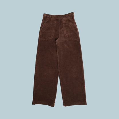 Brown corduroy pants on a pale blue grey background