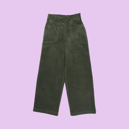 Dark khaki green corduroy pants on a lilac background