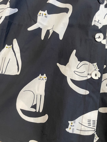 Close up of Origami Doll Penelope Cat Dress fabric