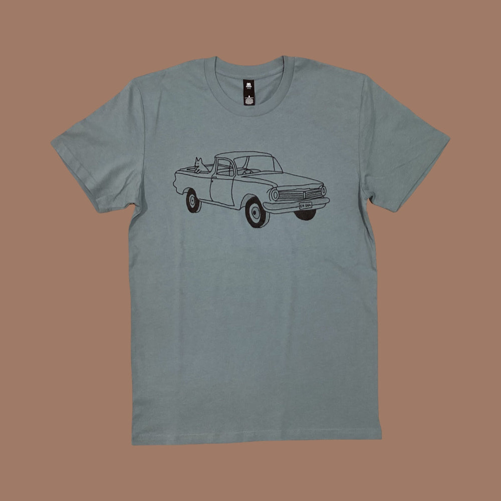 grey/blue t-shirt with a truck graphic on a brown background