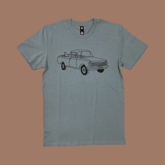 grey/blue t-shirt with a truck graphic on a brown background