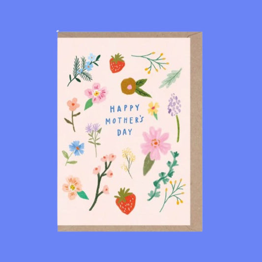 A Mother's Day greeting card with a kraft paper envelope, featuring a cream background decorated with colorful hand-drawn flowers, leaves, and strawberries, with the text 'HAPPY MOTHER'S DAY' in blue.