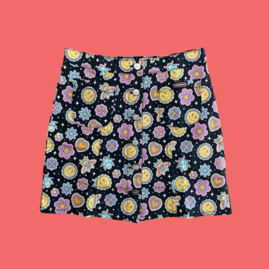 Flatlay of Run and Fly Bee Happy Mini Skirt