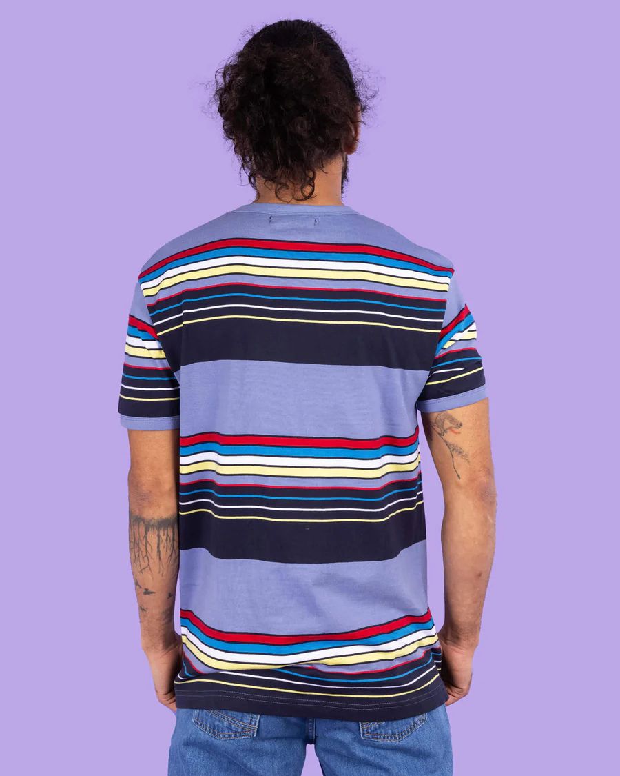 Back view of Model is wearing Run and Fly Blue Stripe Tee.