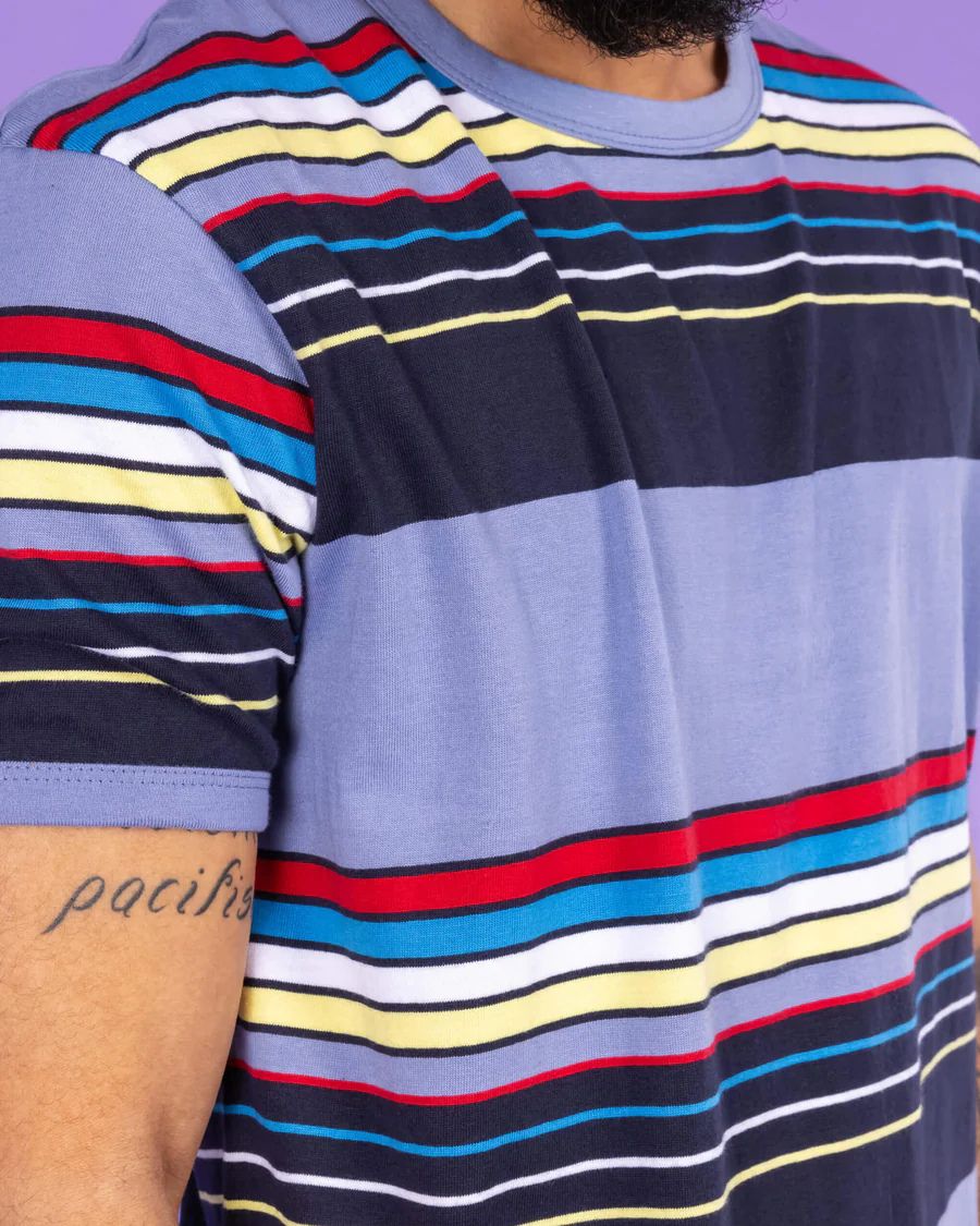 Close up of sleeve and collar detail of Run and Fly Blue Stripe Tee worn by a model.