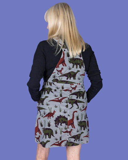 Back view of model wearing a Run and Fly Dino Corduroy Pinafore.