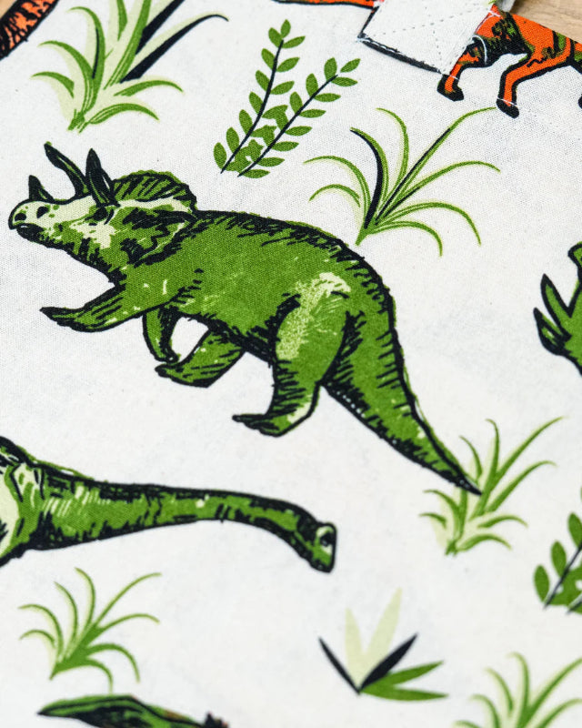 Close up of fabric pattern of Run and Fly Natural Dino Tote Bag