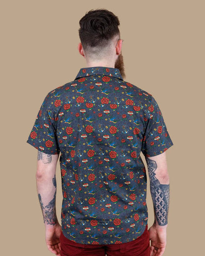 Back view of model wearing a Run and Fly Retro Tattoo Print Shirt.