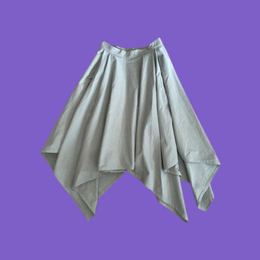 Pale sage green skirt on a purple background